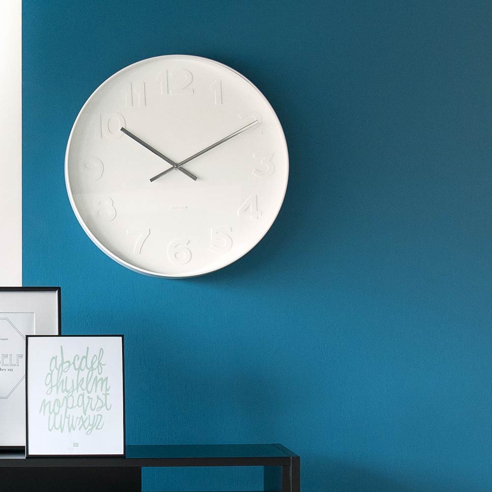 Karlsson Mr White Wall Clock Small hanging on a blue wall at House