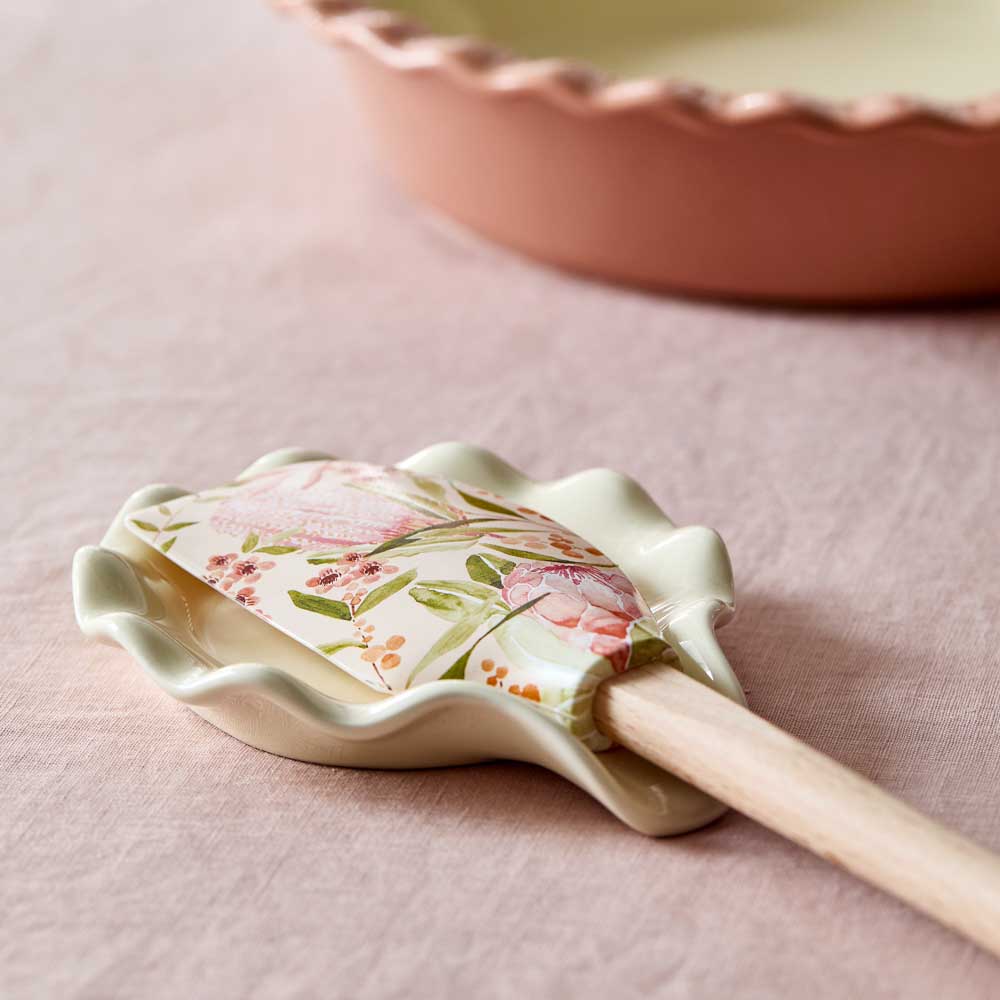 Alex Liddy Posy Spoon Rest Cream with holding spatula at House