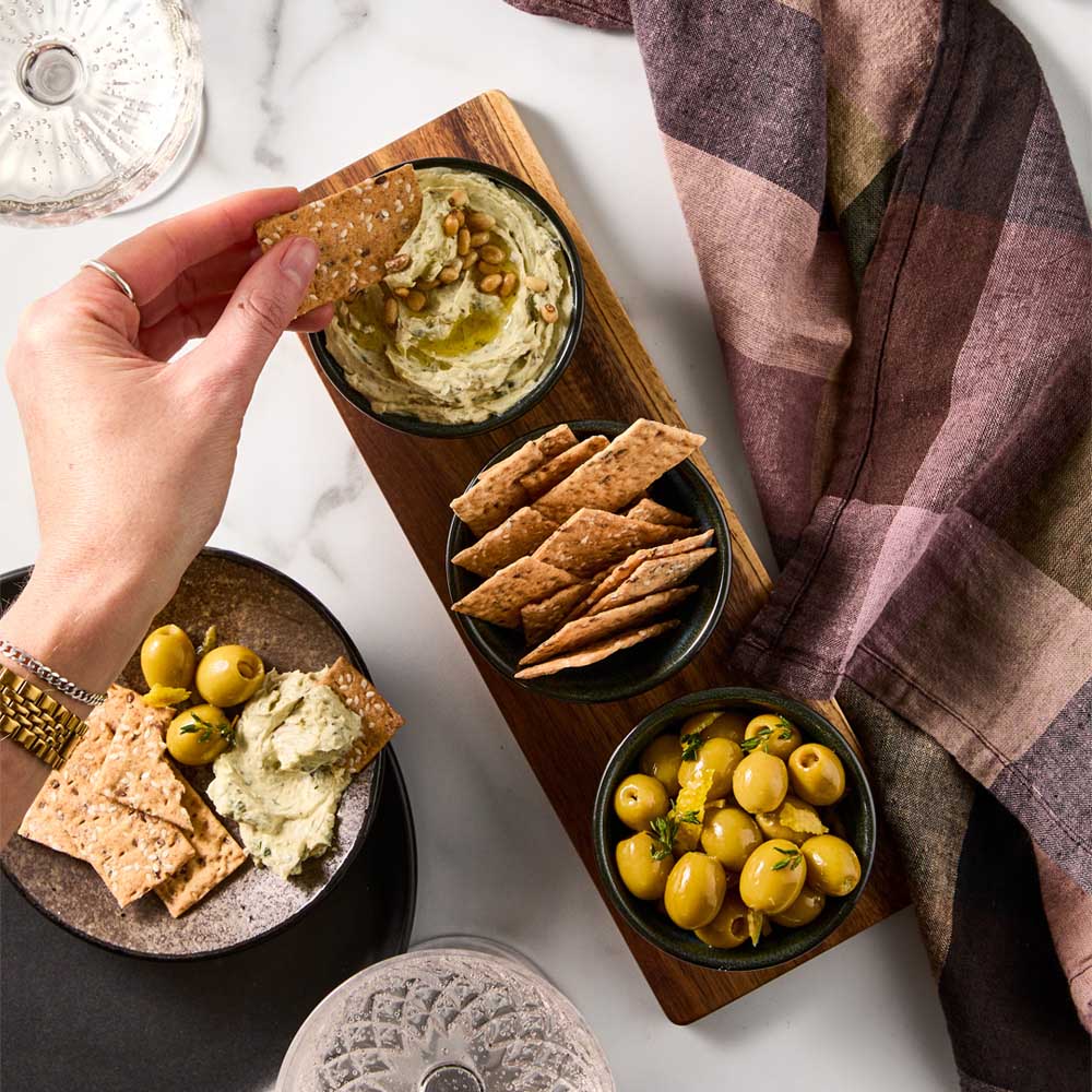 Serving Board with 3 Green Bowls with dip, olives, and crackers - House
