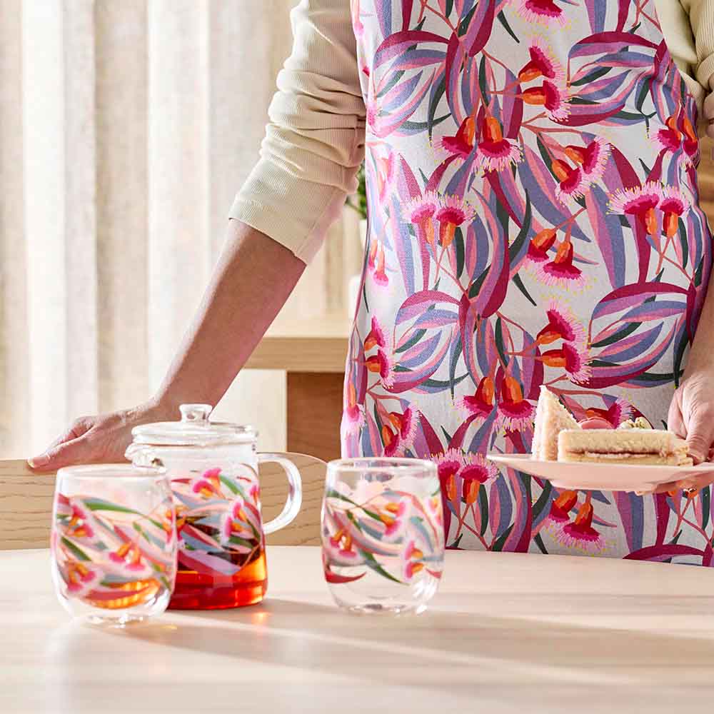 woman wearing an apron with a gumnut design