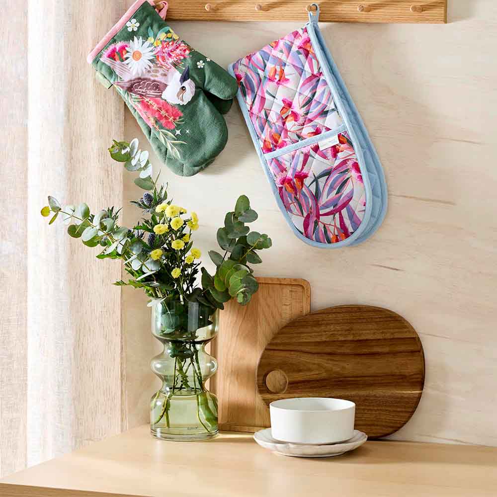 hanging sets of oven gloves in Australian flora and fauna prints
