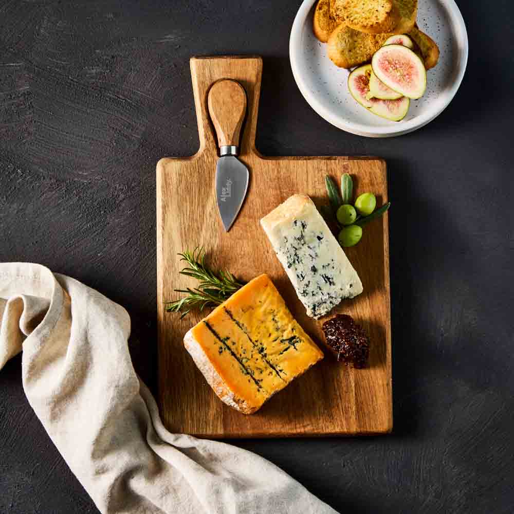quince paste on cheese board with knife - House