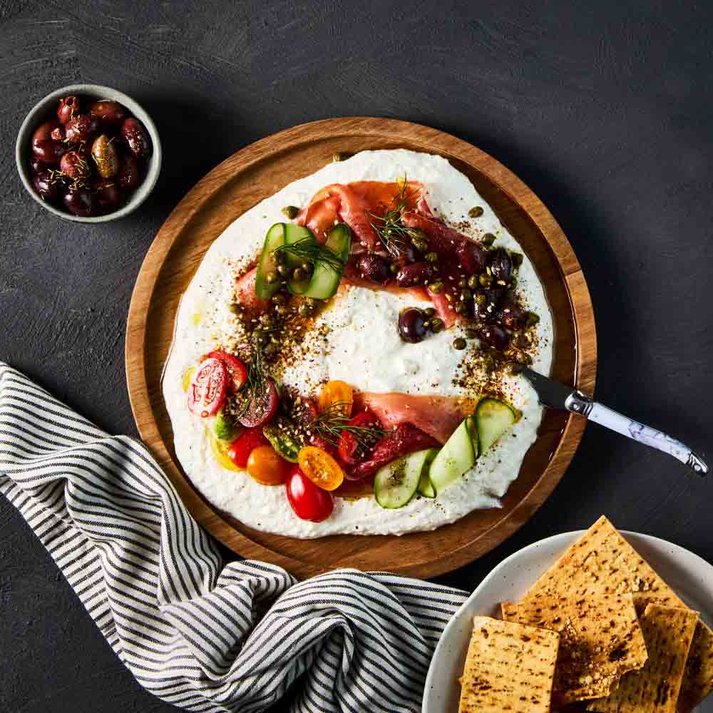 dip with corn chips on a wooden platter - House