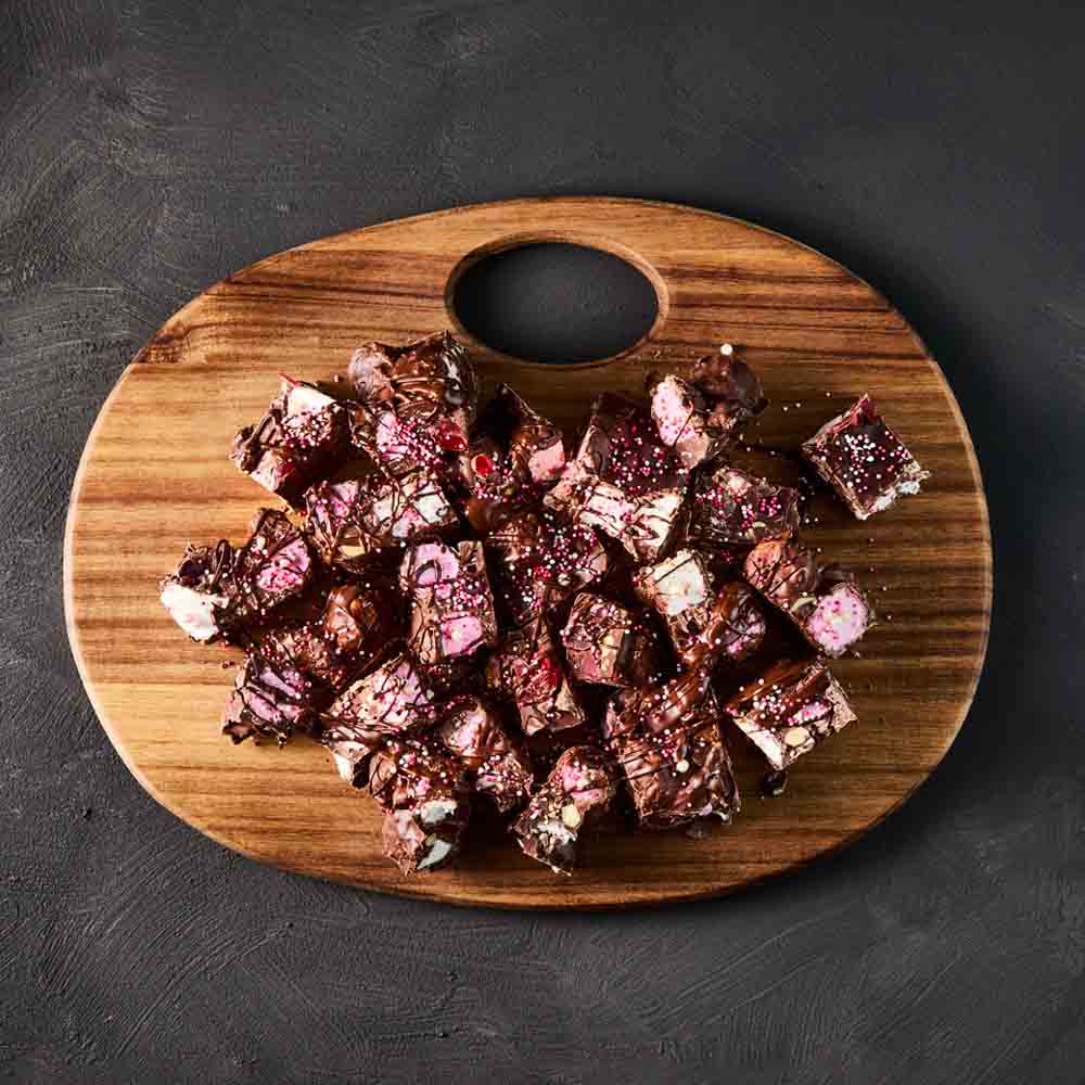 wooden serving board filled with rocky road