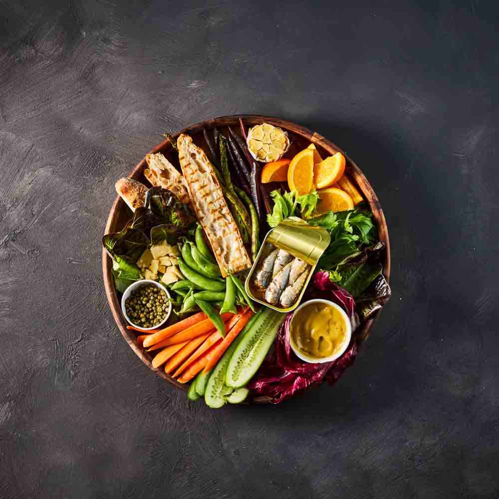 round wooden serving board filled with ingredients