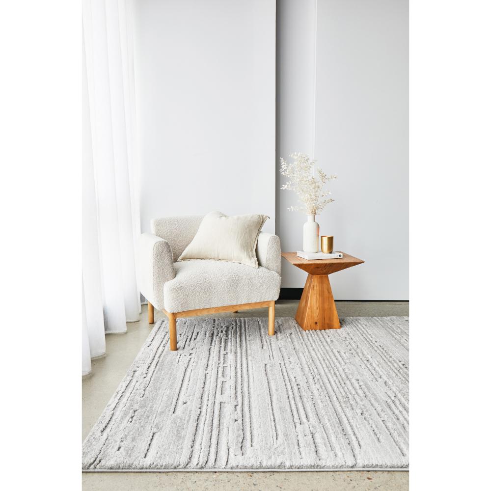Rug Culture Serenade Ezra Rug Silver with cream boucle chair at House