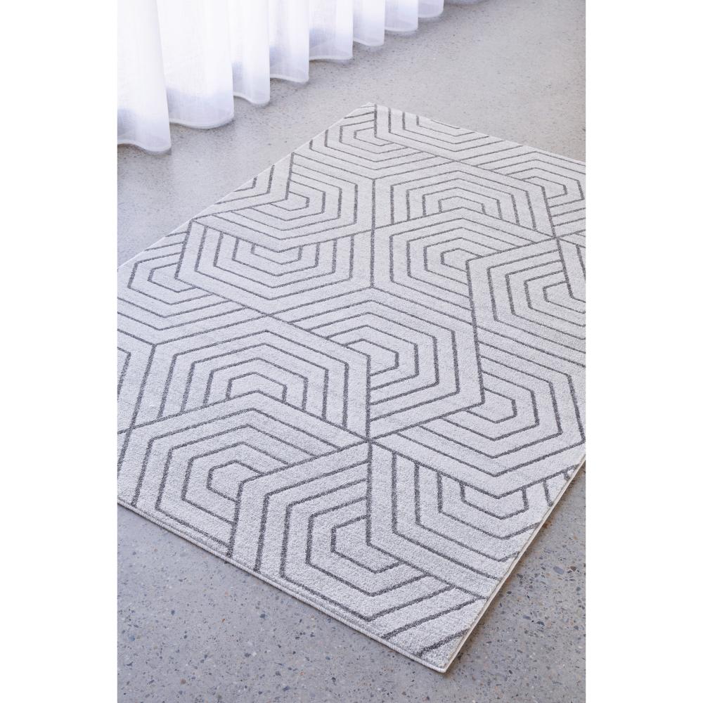 grey modern rug with art deco design by the window - House