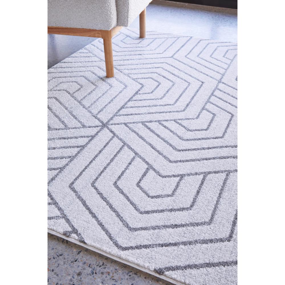 grey modern rug with cream armchair - House