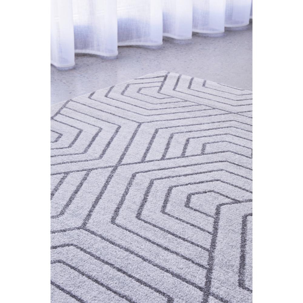 grey modern rug with art deco design by the window - House
