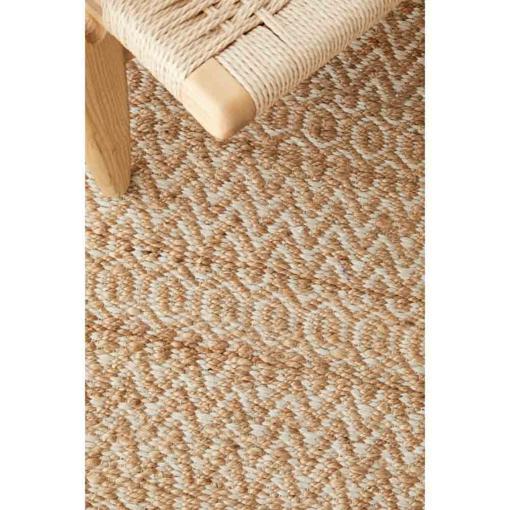 warm beige textured jute rug with a chair - House