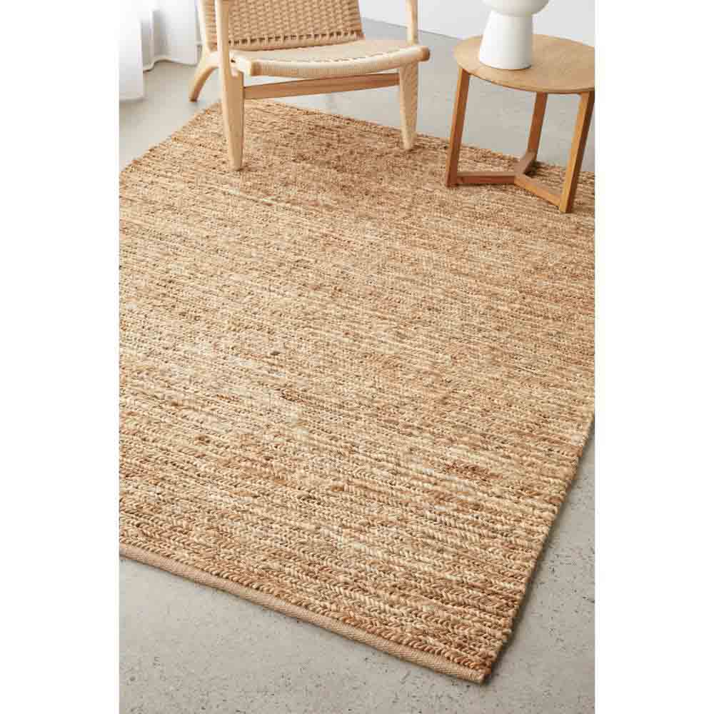 natural brown beige jute rug with armchair and table - House
