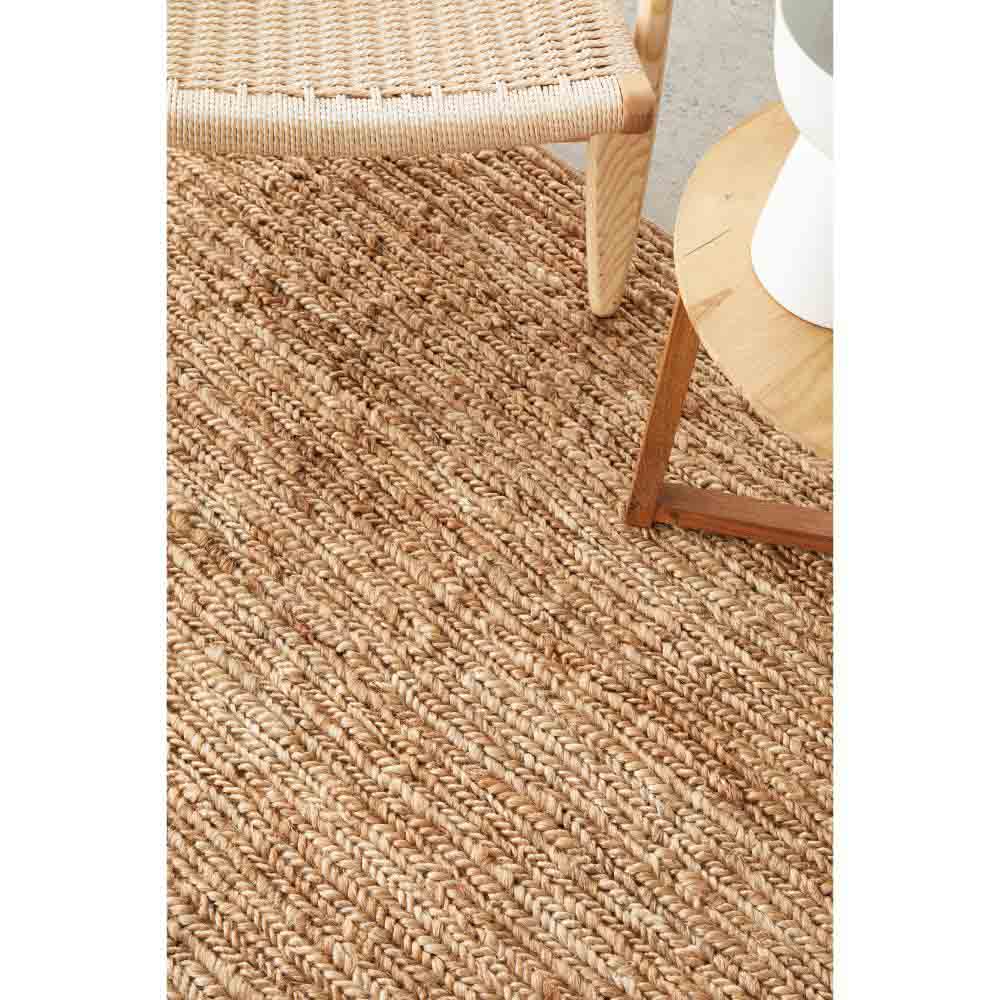 natural brown beige jute rug with armchair and table - House