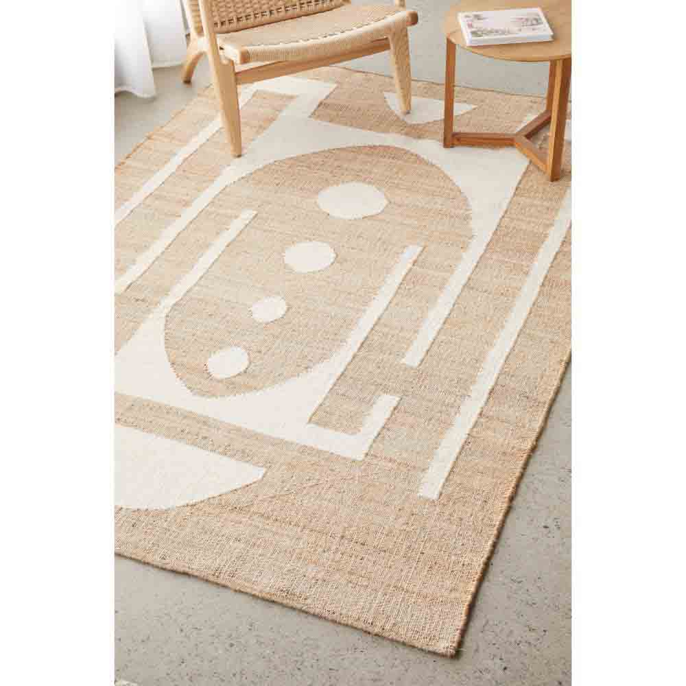 Natural beige wool jute bohemian rug with armchair and table - House