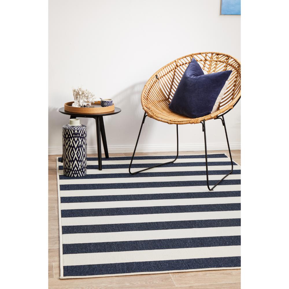 Blue and white stripe indoor/outdoor rug with armchair - House