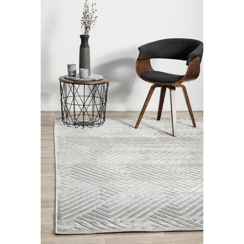 silver grey chevron rug with armchair and side table - House