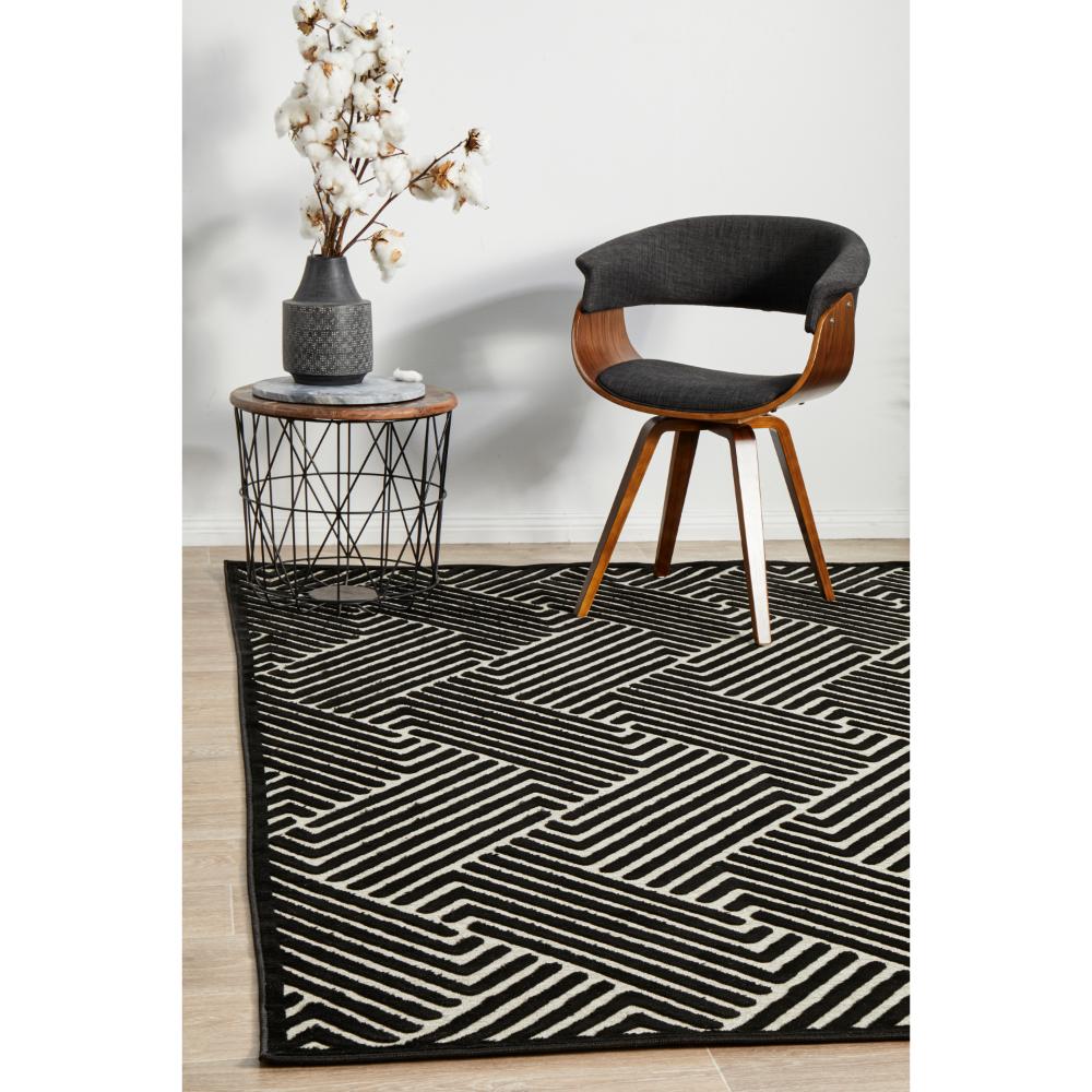 black and cream chevron rug with armchair and side table - House