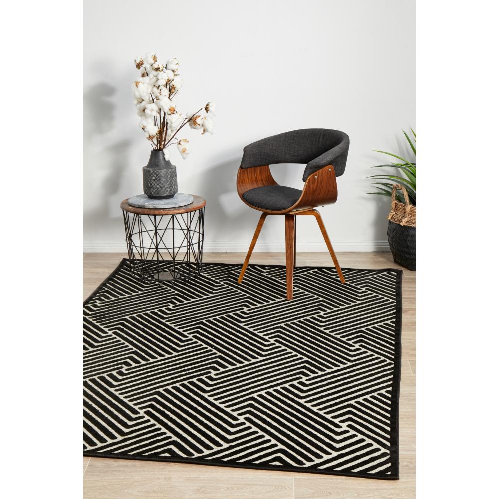 black and cream chevron rug with armchair and side table - House