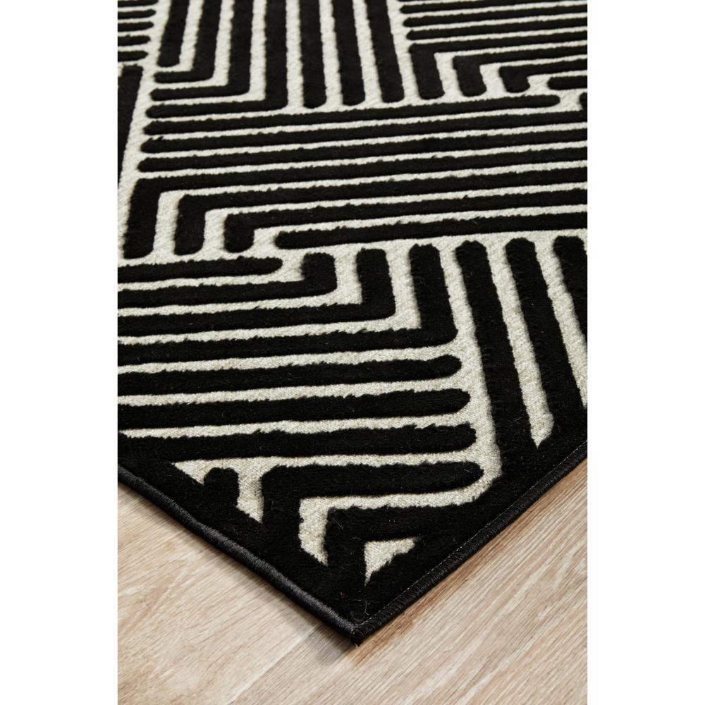 black and cream chevron patterned rug detail image - House