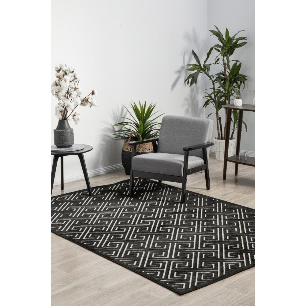 black and beige geometric swirl rug in sitting room - House