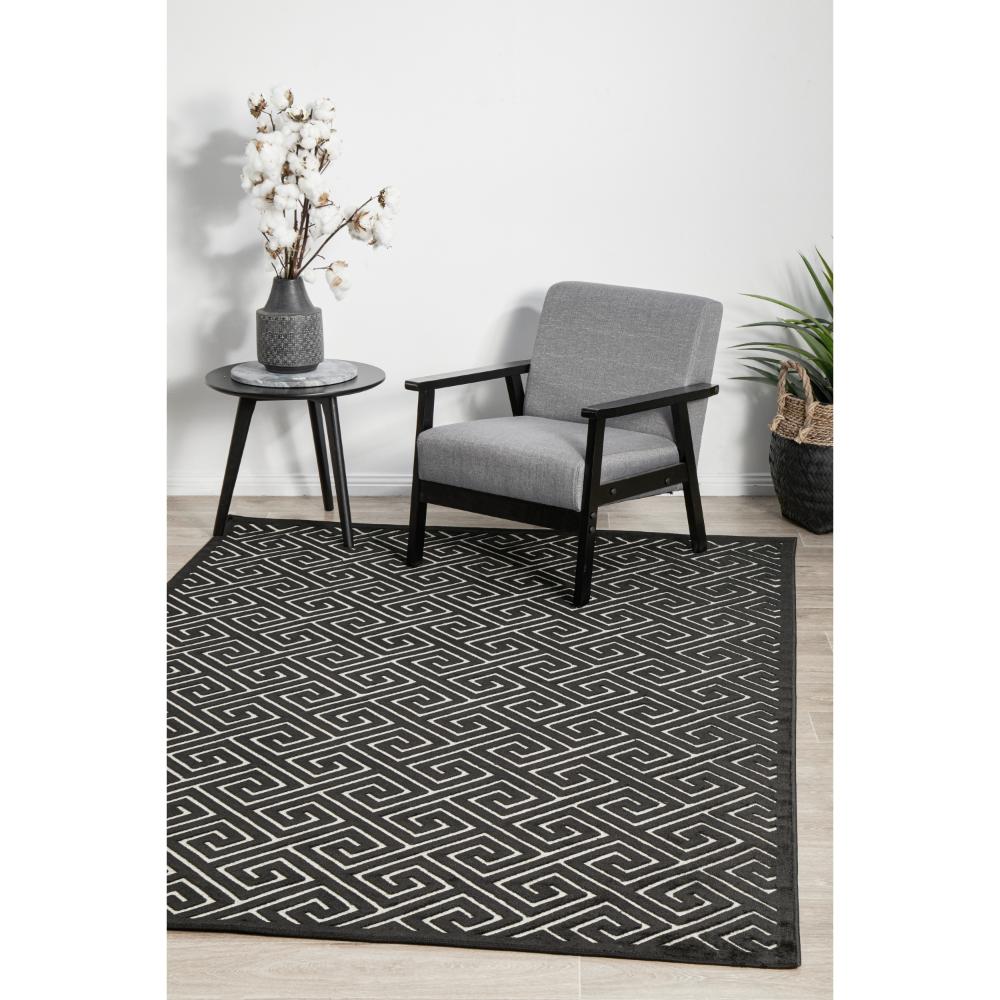 black and beige geometric swirl rug in sitting room - House