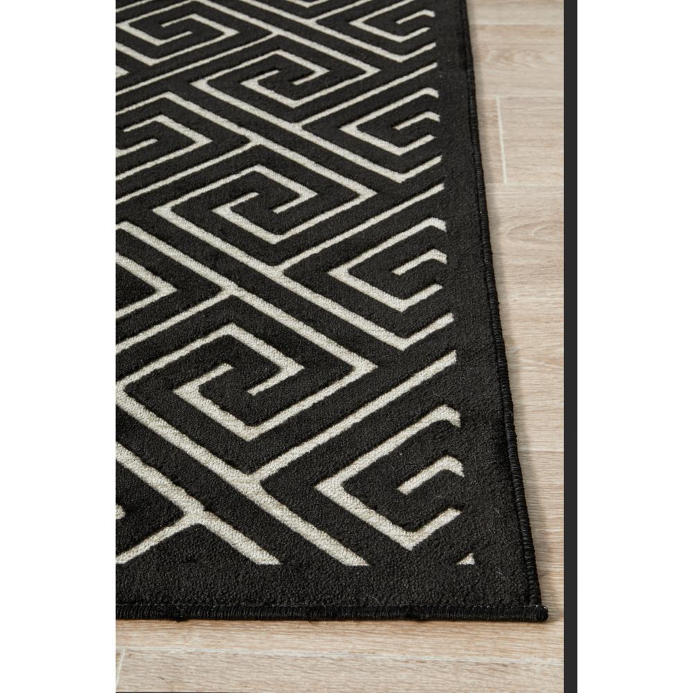 black and beige geometric swirl rug detail image - House