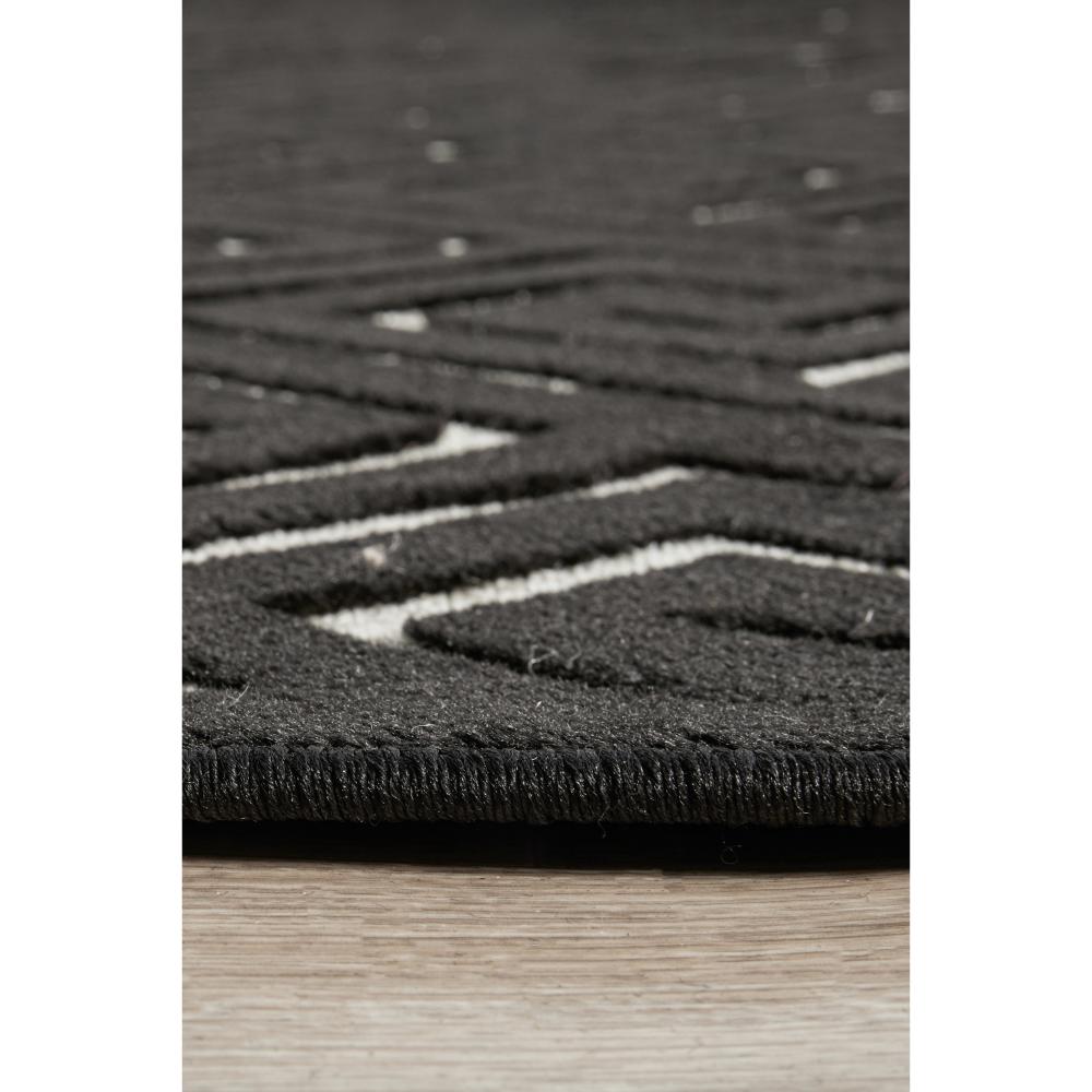 black and beige geometric swirl rug detail image - House