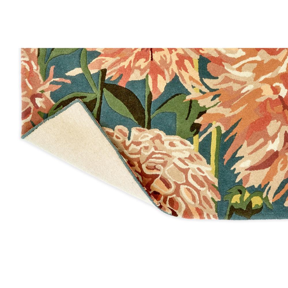 designer large orange dahlia flower wool rug detail shot - House