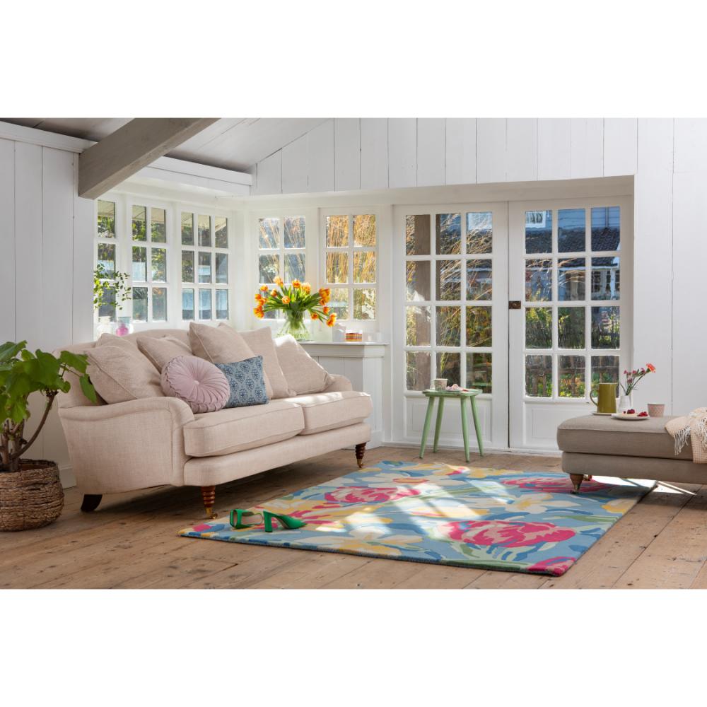 Tulips wool rug in sunroom with couch - House