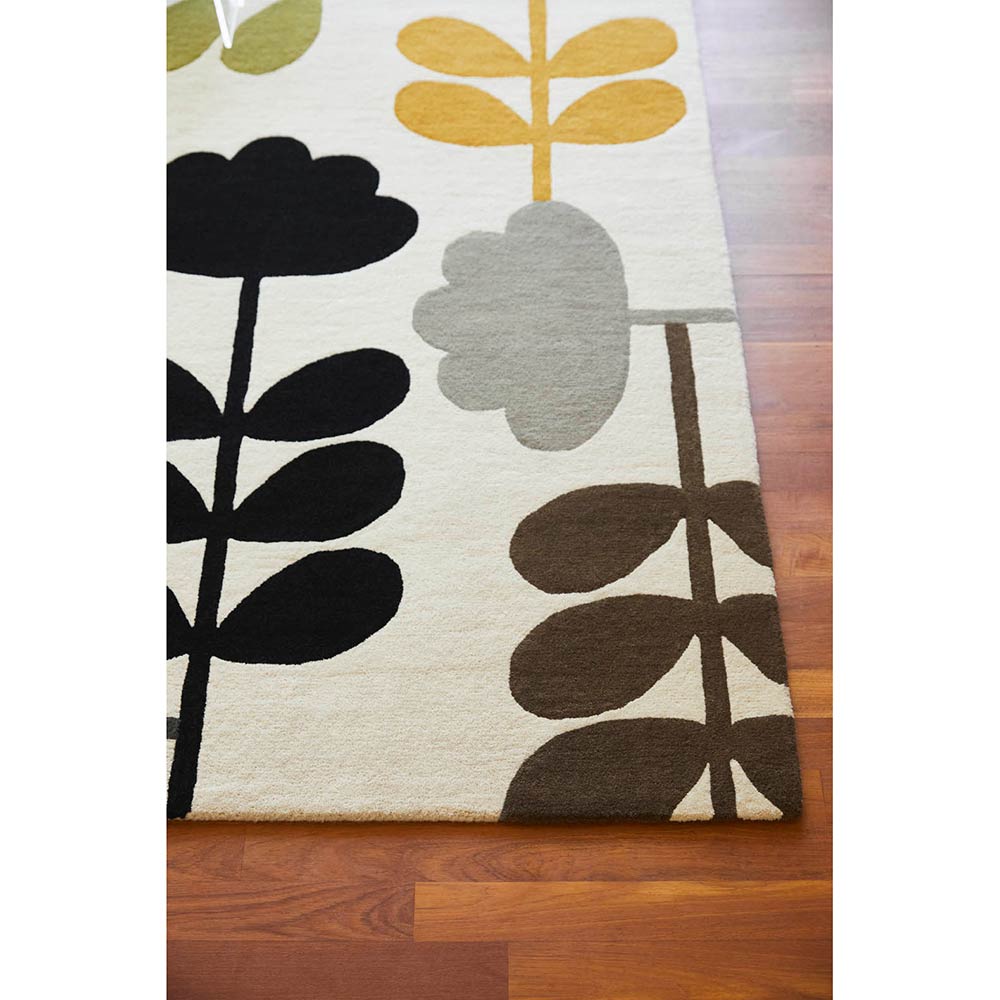 Multicolour flower wool rug on wooden floors - House