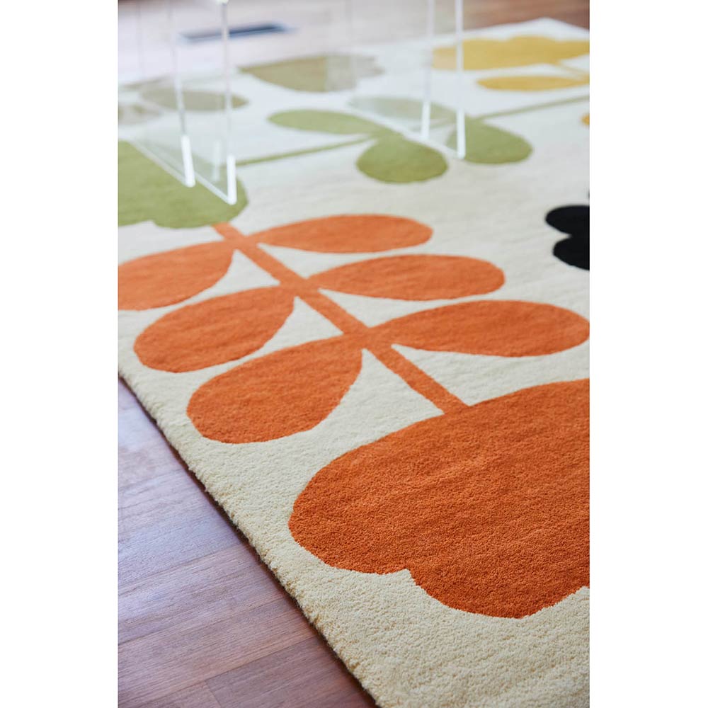Multicolour flower wool rug on wooden floors - House