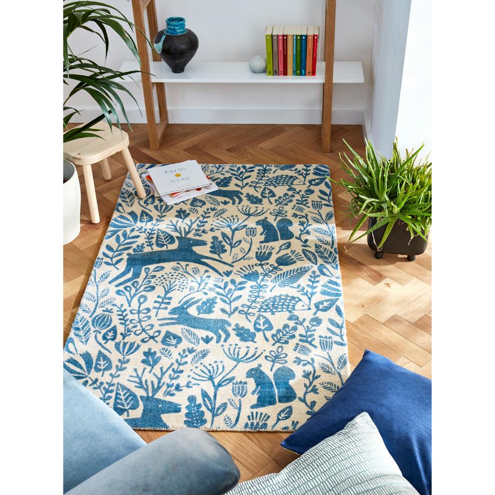 blue printed woodland creatures wool rug in sitting room - House