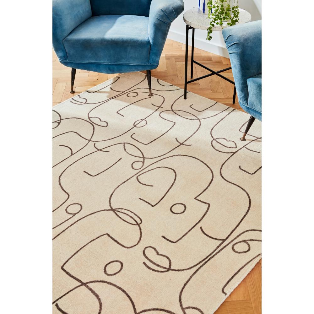 abstract face design Wool Rug with blue armchairs - House