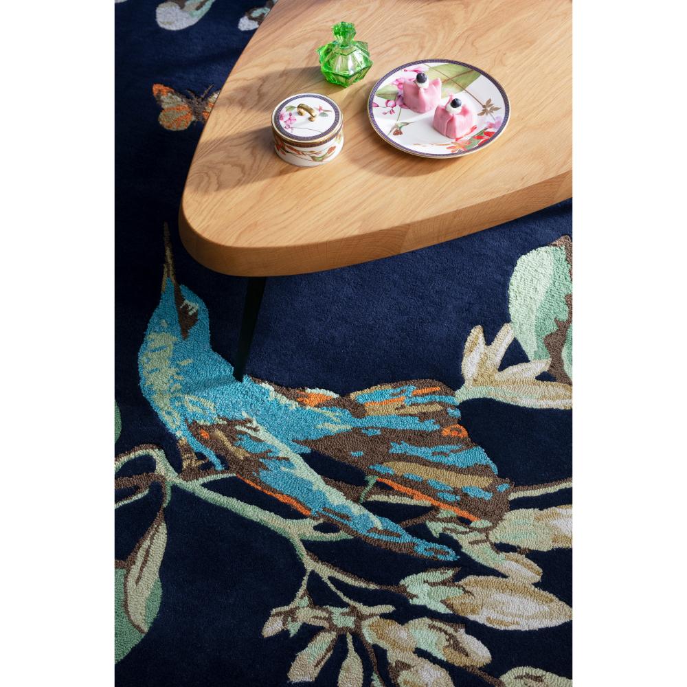 Hummingbird and floral blue wool rug with coffee table - House