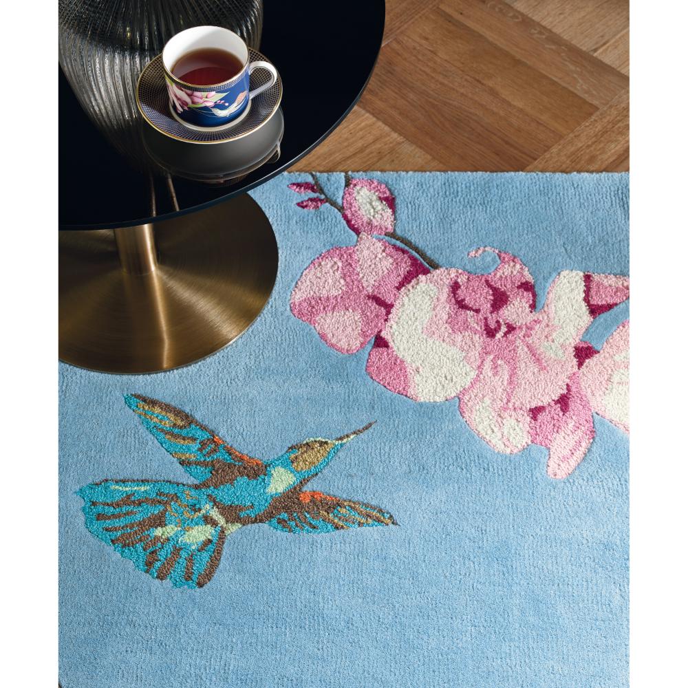Hummingbird and floral blue wool rug with coffee table - House