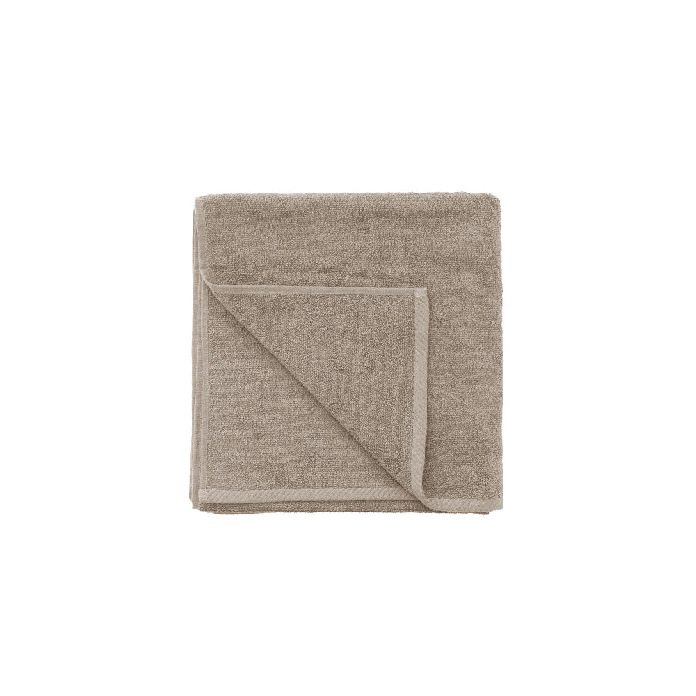 The Bambury Chateau Latte bath towels folded showing the quality and colour.
