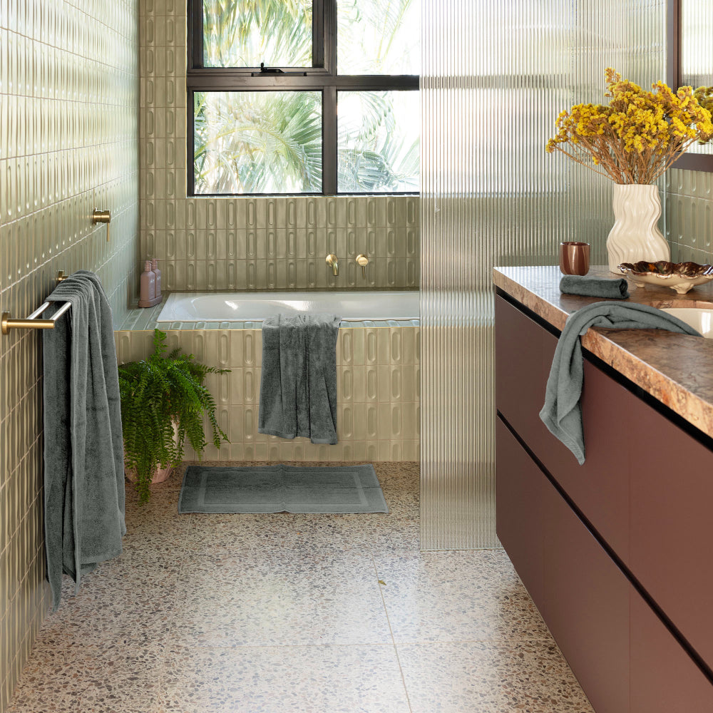 The Bambury Chateau bath range in charcoal is displayed across the bathroom conveniently ready for use.