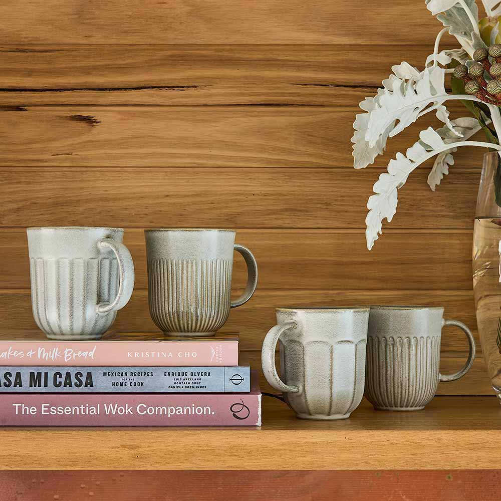 Ecology Chapel Set of 4 Mugs 330ml Blue on a shelf with books at House