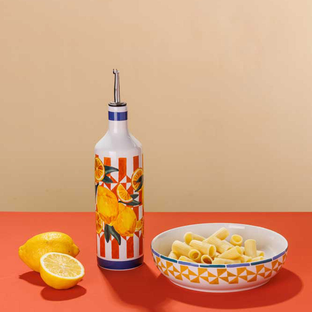 Porto Valentina Round Serving Bowl 32cm next to a oil bottle and lemons at House