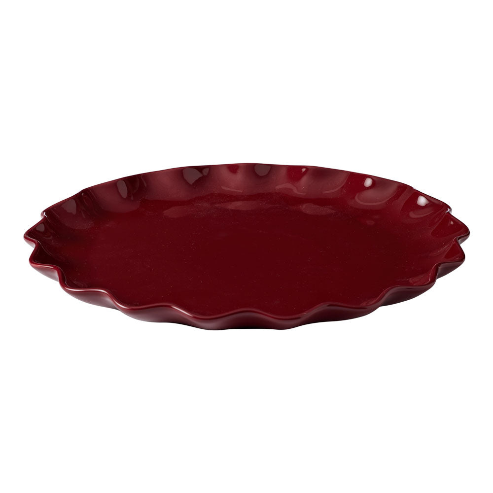 The Ecology round platter featuring a ruffle design on the edges, and an elderberry glossy finish.