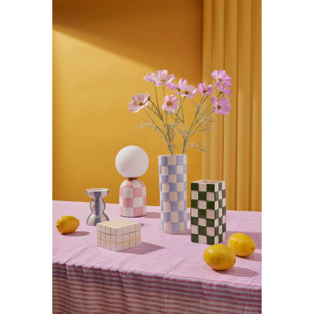 Emporium Lulu Collection - various sized ceramic vases, boxes, and bowls on pink and white tablecloth at House