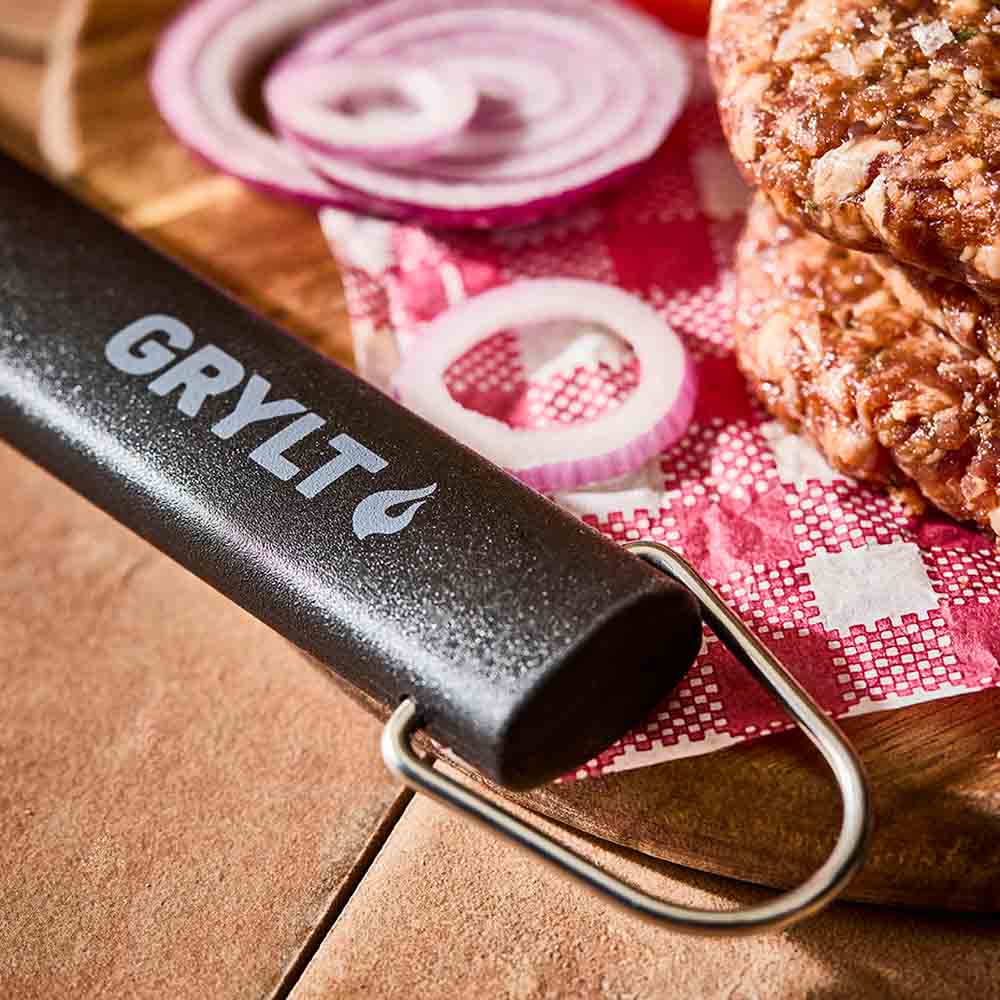 close up of BBQ utensil with hanging loop - House 