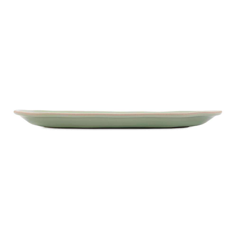 Jamie Oliver holding a large yellow serving bowl full of salad - House
