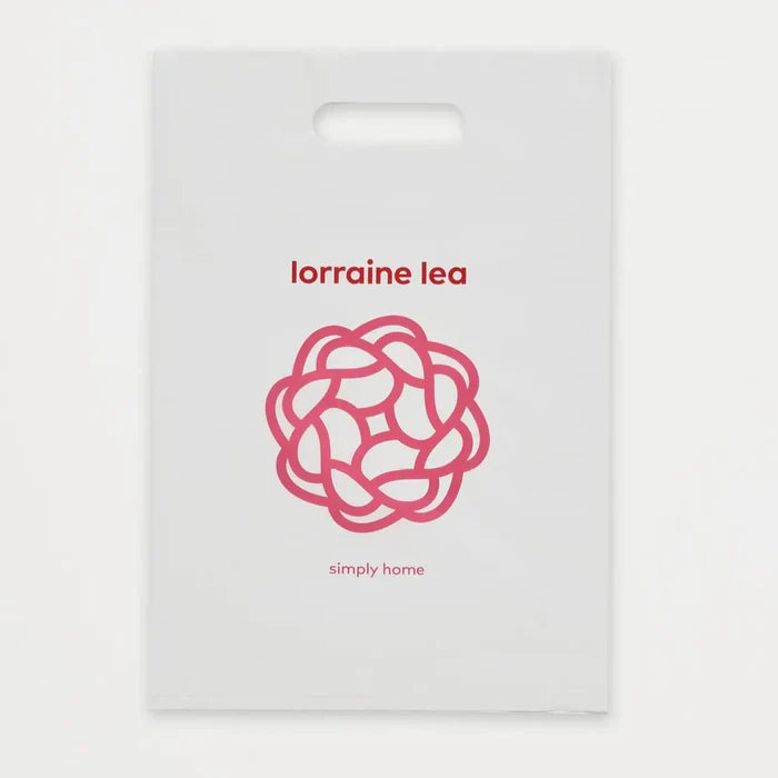 White packaging with red 'lorraine lea' branding and a decorative logo on a white background