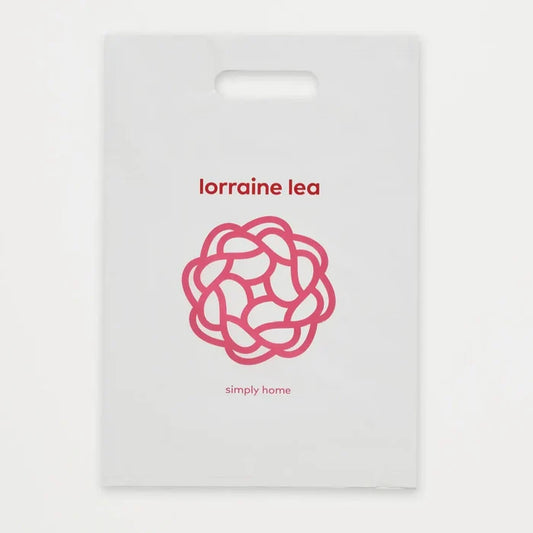 White packaging with red 'lorraine lea' branding and a decorative logo on a white background