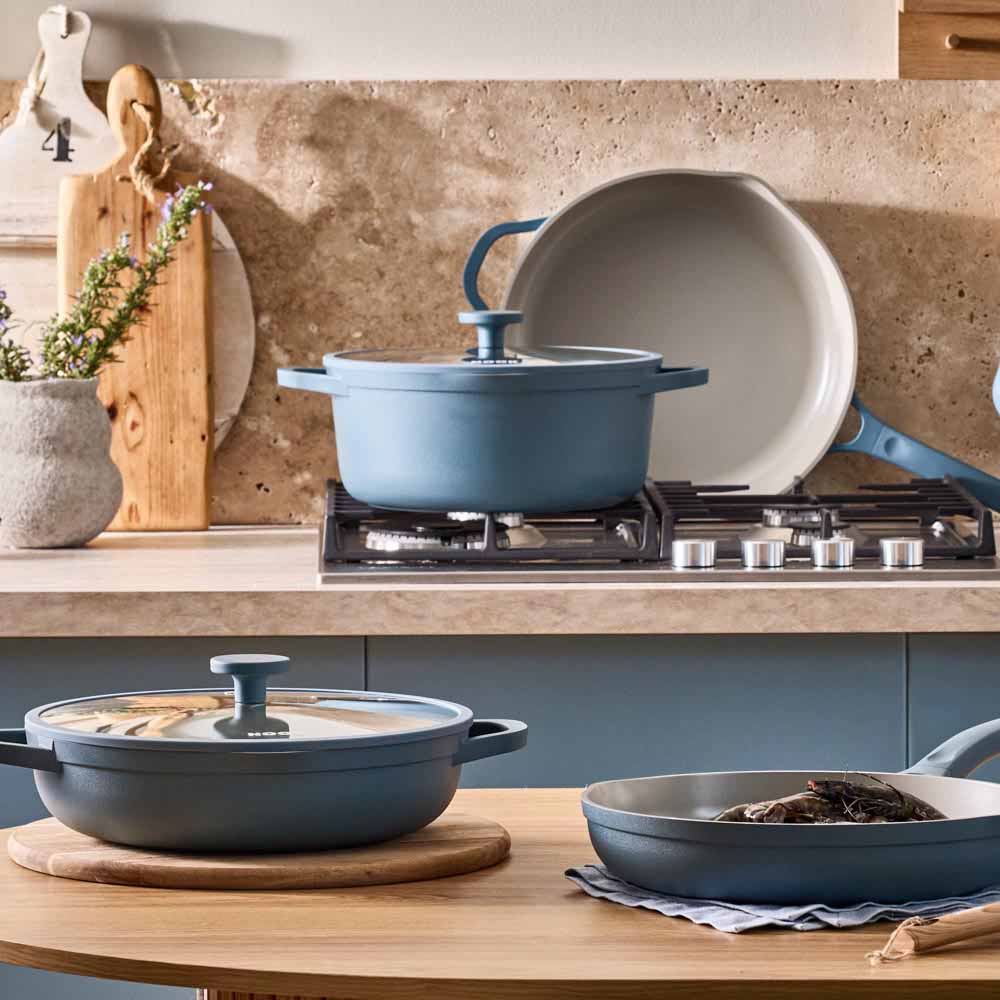 range of blue frypans, saucepans and utensils
