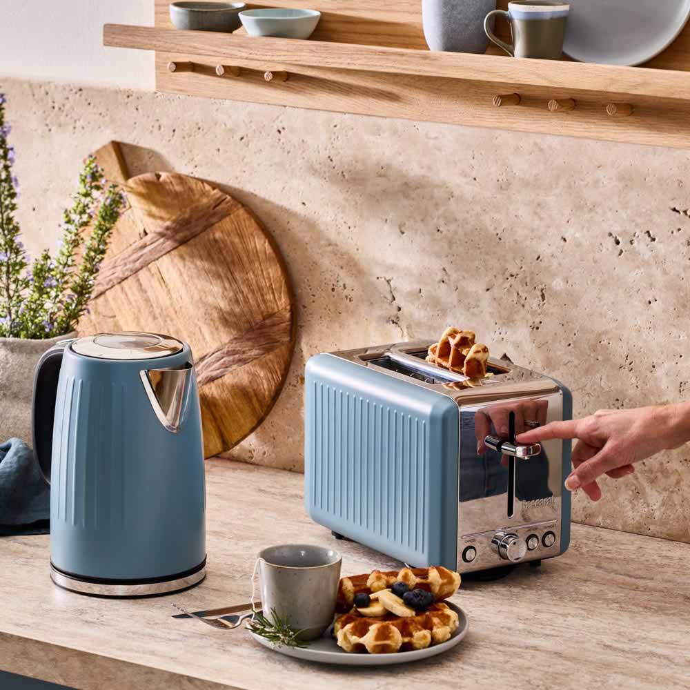 blue kettle and blue toaster on the kitchen counter