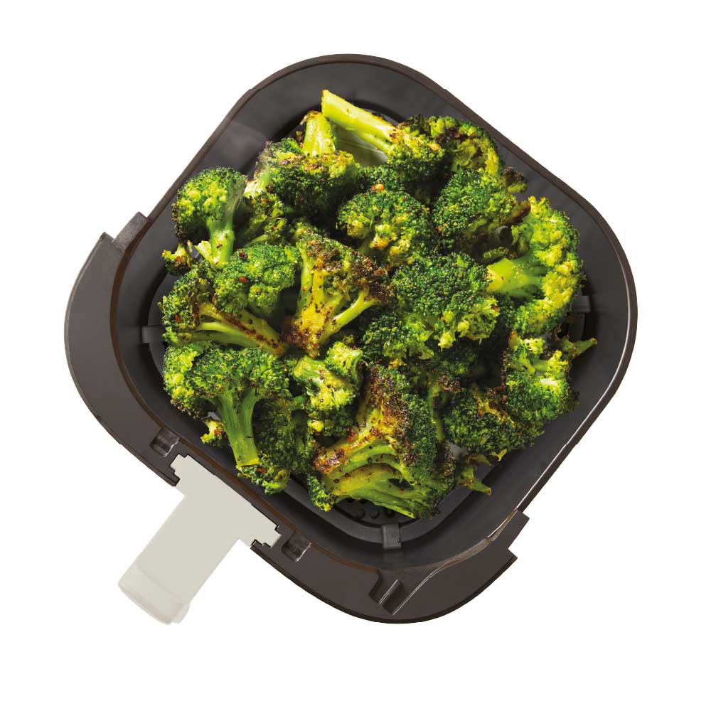 air fryer drawer filled with broccoli