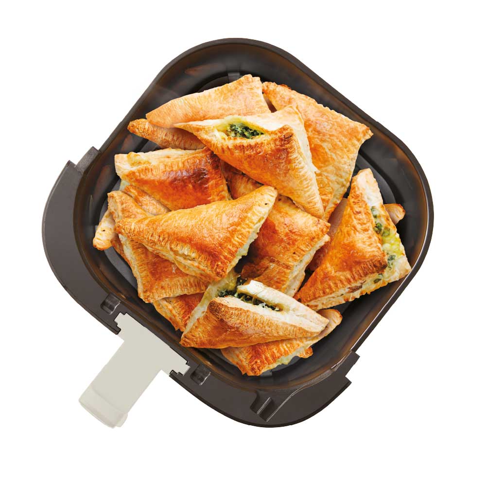 air fryer drawer filled with pasties