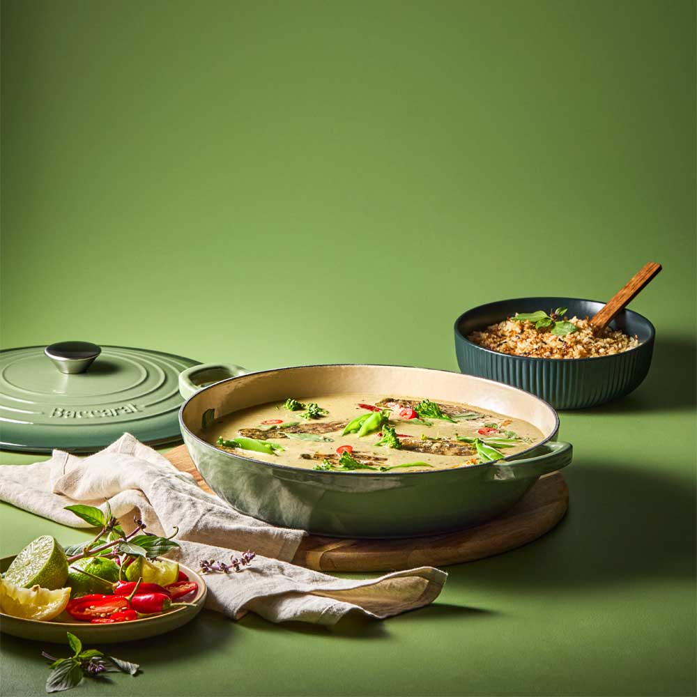curry in green saute pan with a side of rice - House