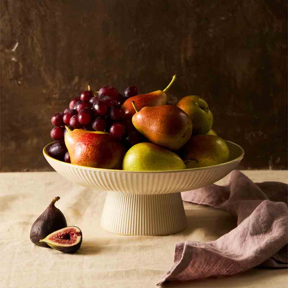 Stoneware ribbed Footed Serving Bowl filled with fruit - House